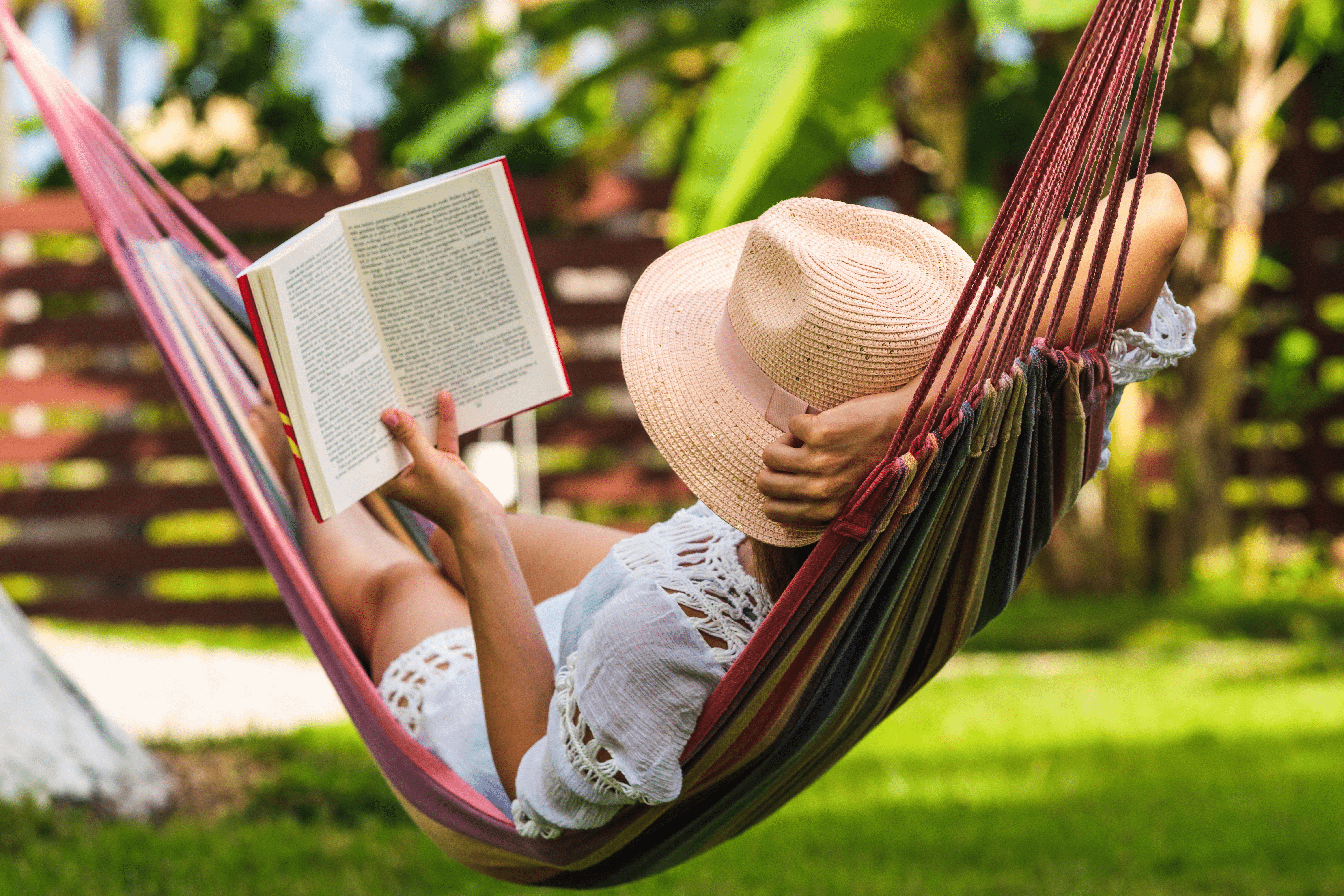 Woman Reading in a Hammock #image_title